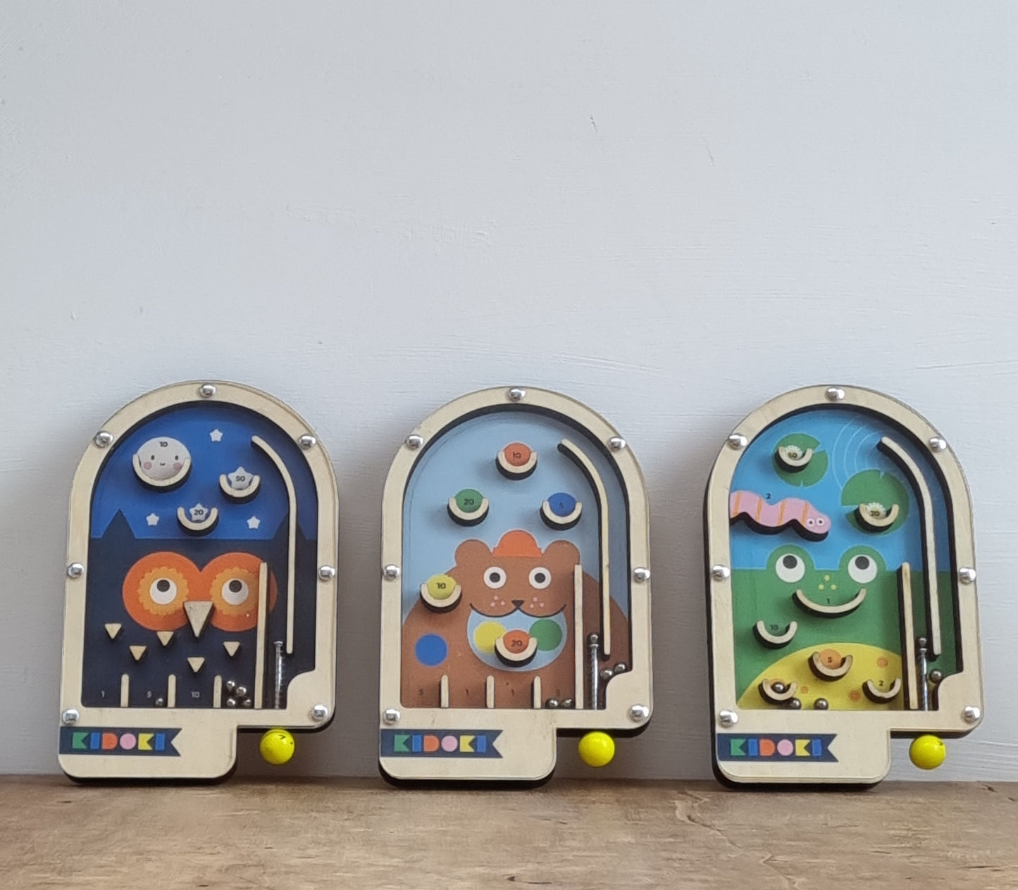 Wooden pin ball game