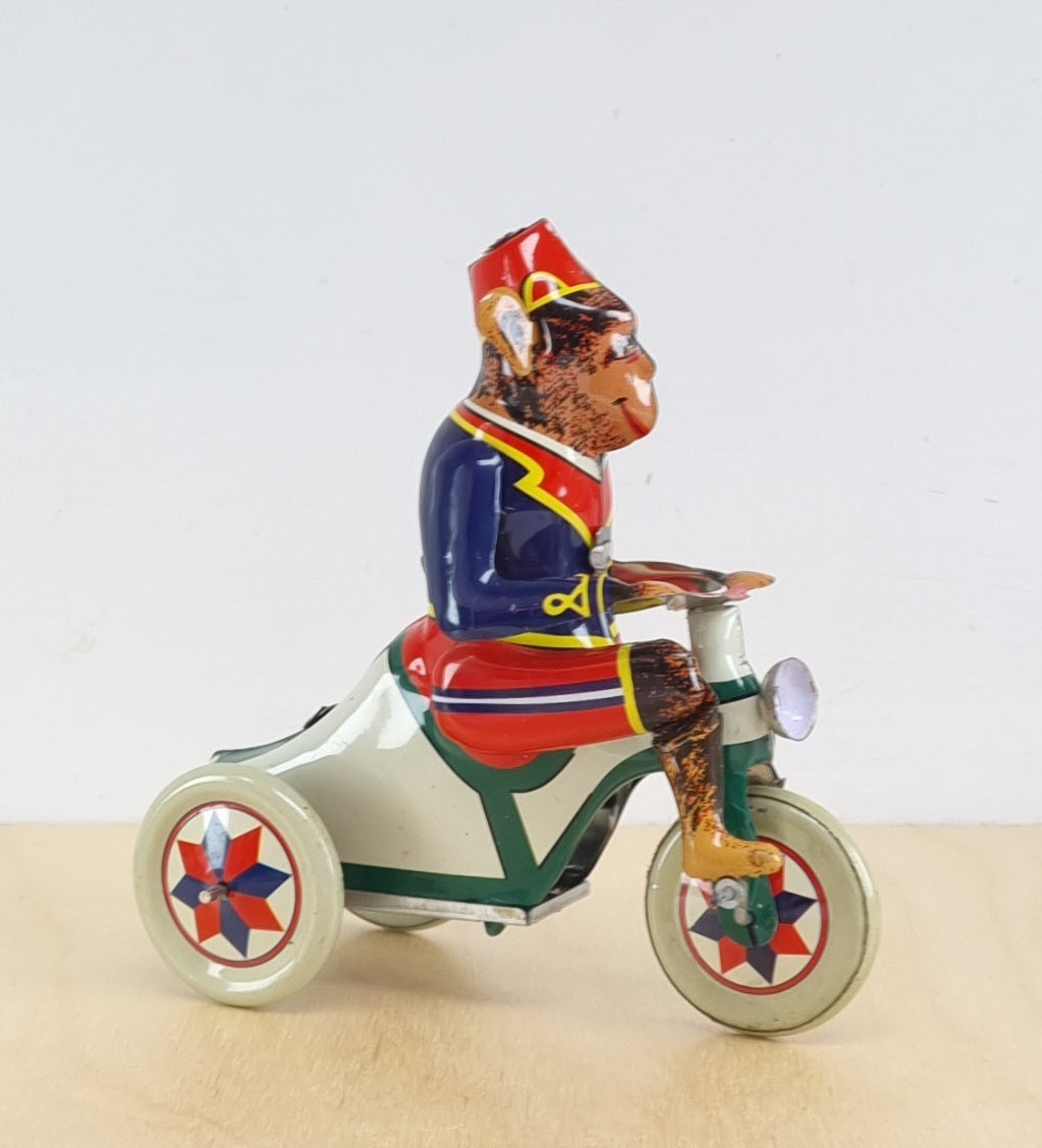 Tin monkey on trike
