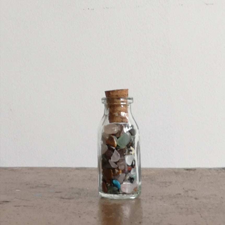 Mini gemstones in a  bottle
